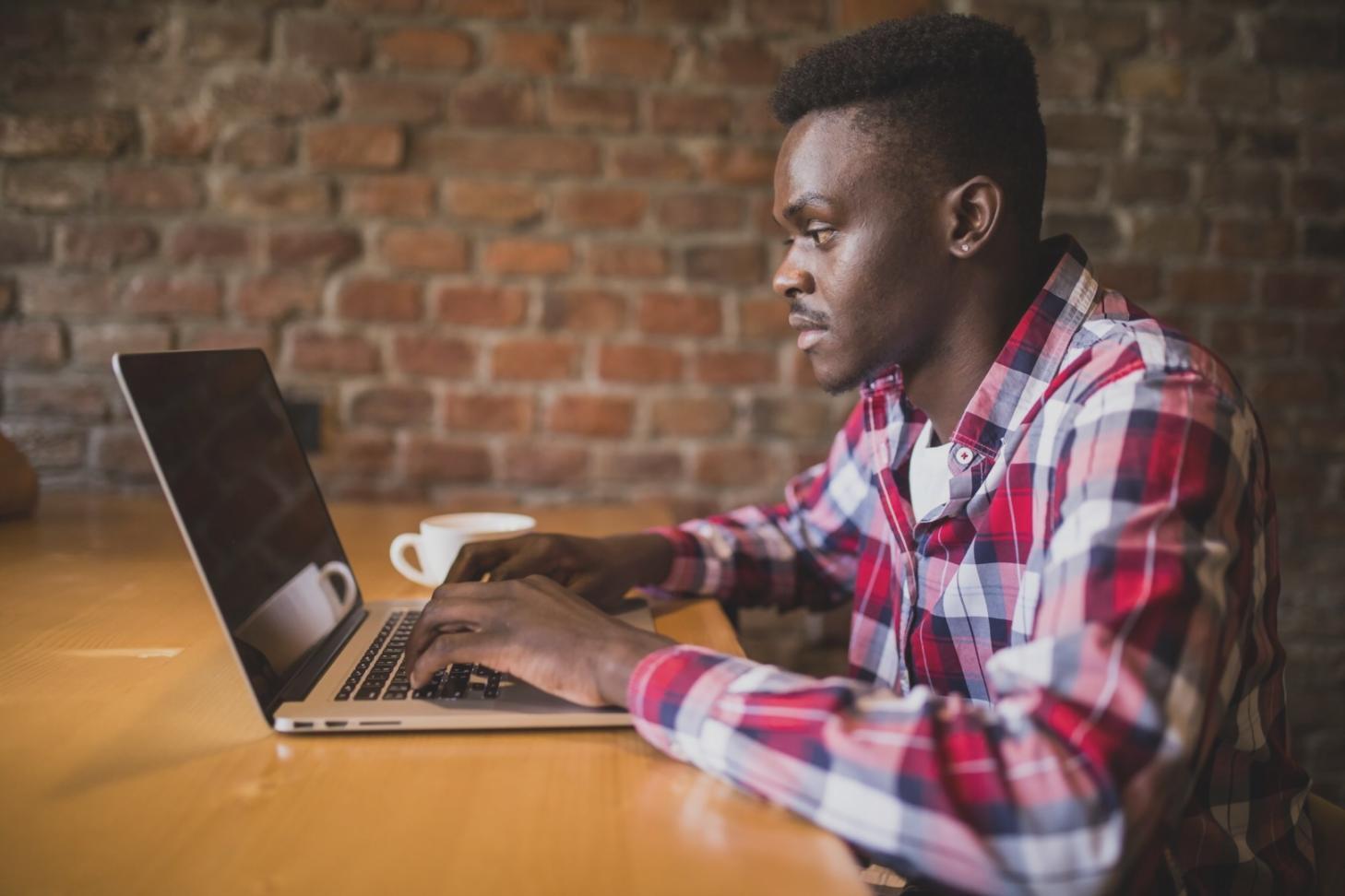 Students collaborating on blockchain development projects in modern learning environment